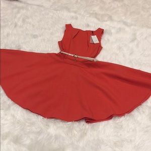 Orange sun dress with pockets and beige belt